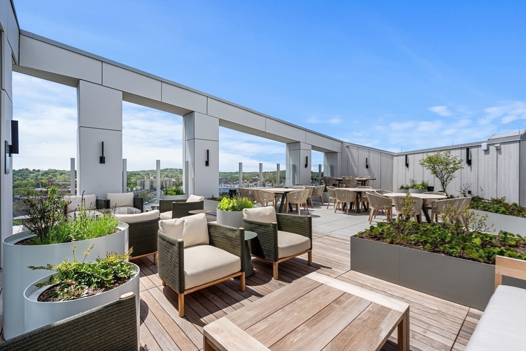 1515 Commonwealth Avenue, Unit 504 Boston, MA 02135 - Photo 37 of 41 a living room with furniture and a large window