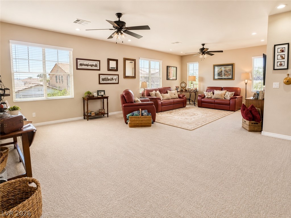 9724 University Ridge Avenue Las Vegas, NV 89149 - Photo 56 of 61 Ample windows illuminate this generous living space, perfect for comfortable gatherings.