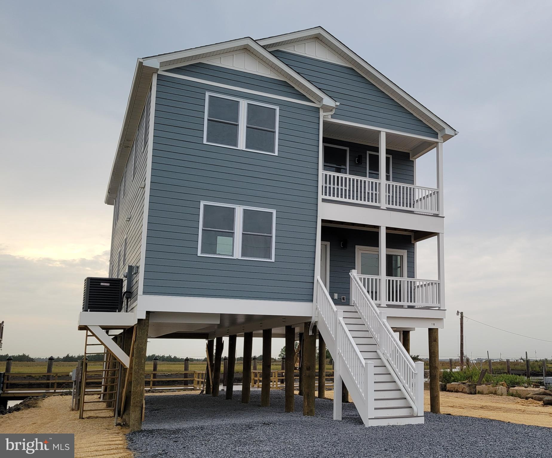 116 Sawyer Road Milford, DE 19963 - Photo 1 of 33 a front view of a house with many windows