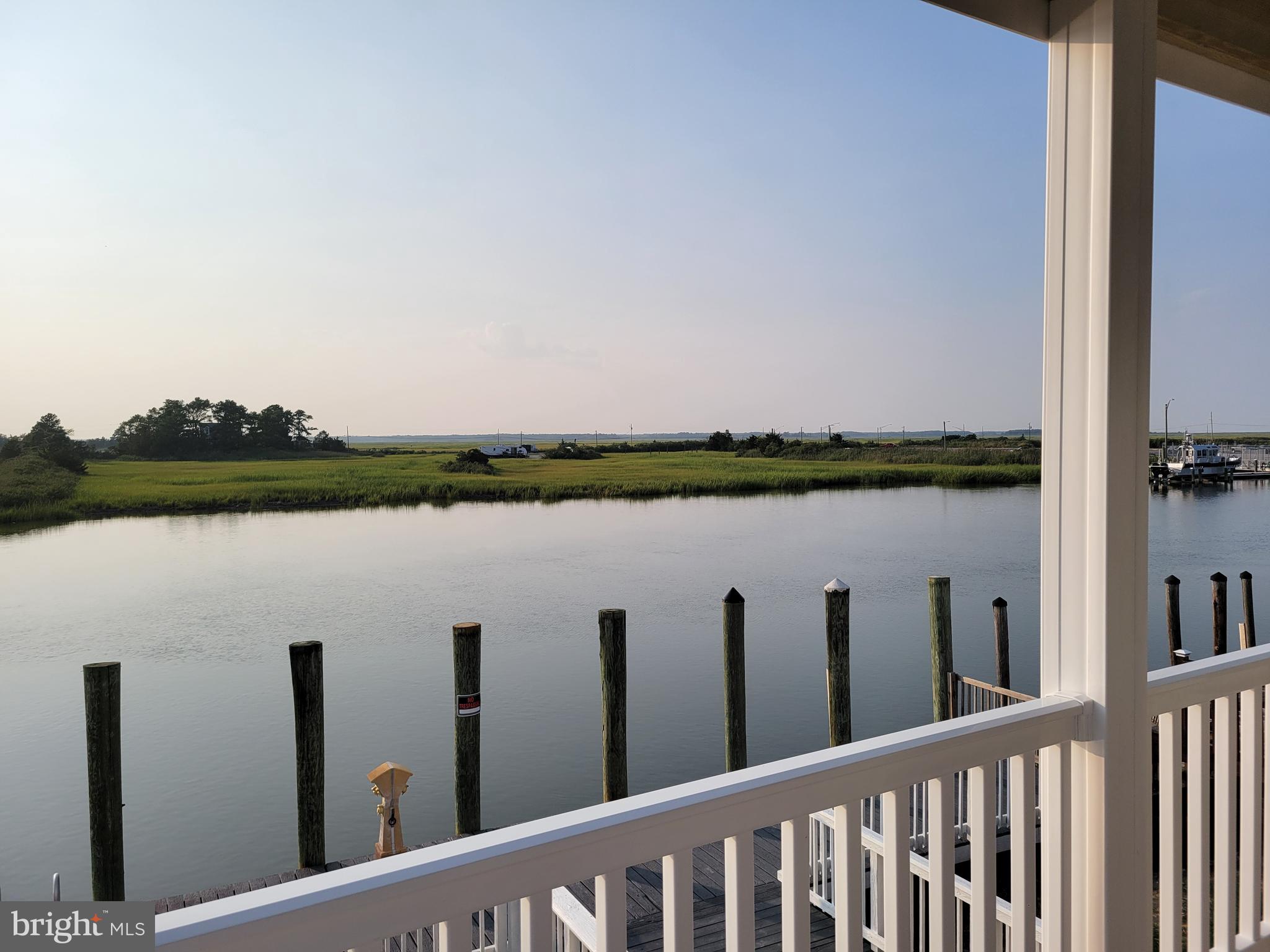116 Sawyer Road Milford, DE 19963 - Photo 12 of 33 a view of a lake from a balcony