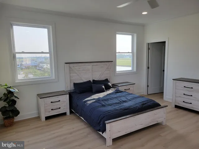a bedroom with a bed and a dresser
