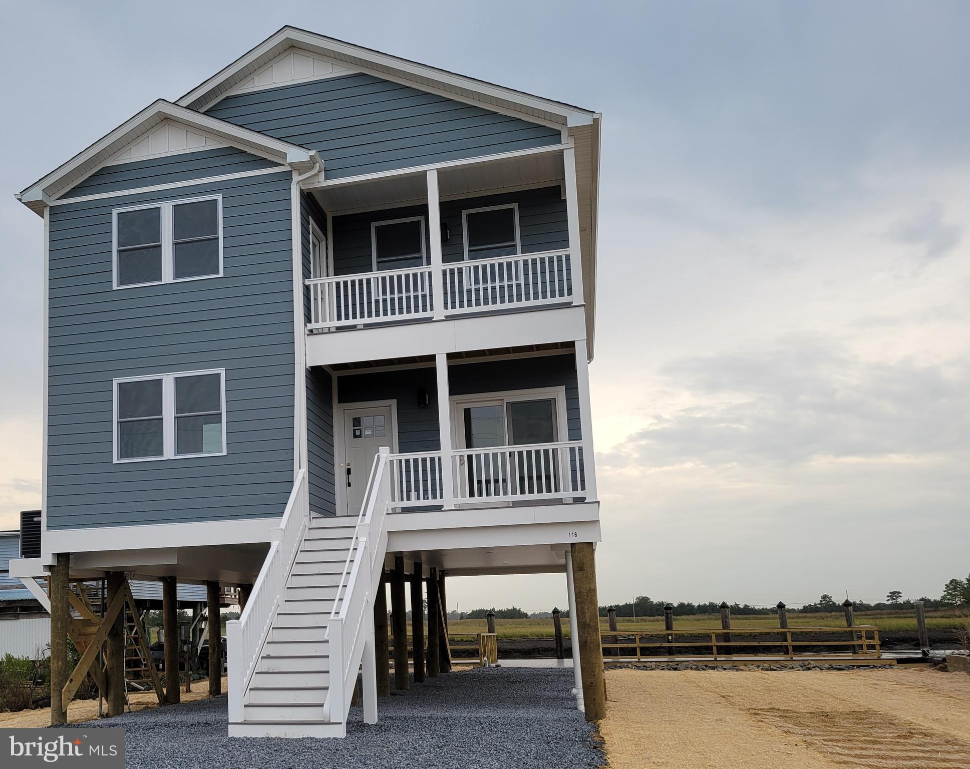 116 Sawyer Road Milford, DE 19963 - Photo 2 of 33 a front view of a house with balcony