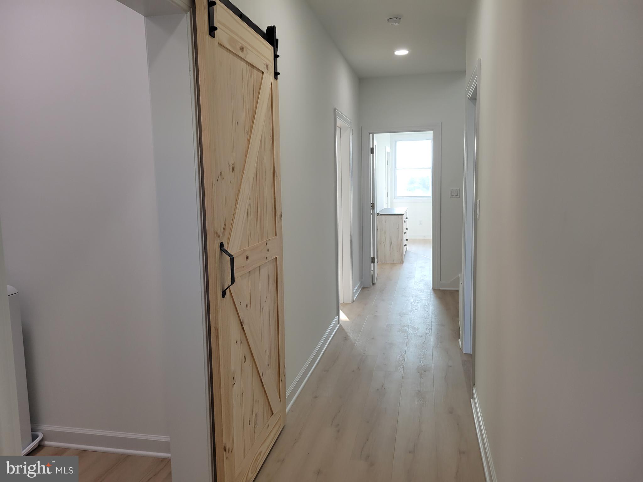 116 Sawyer Road Milford, DE 19963 - Photo 25 of 33 a view of hallway with wooden floor