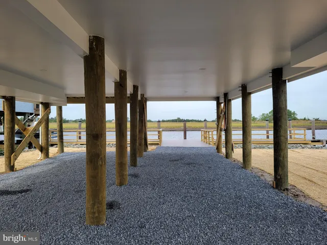 a view of an empty room with floor to ceiling windows