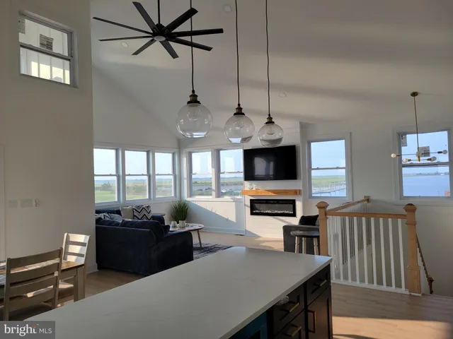 a view of a livingroom with furniture window and wooden floor