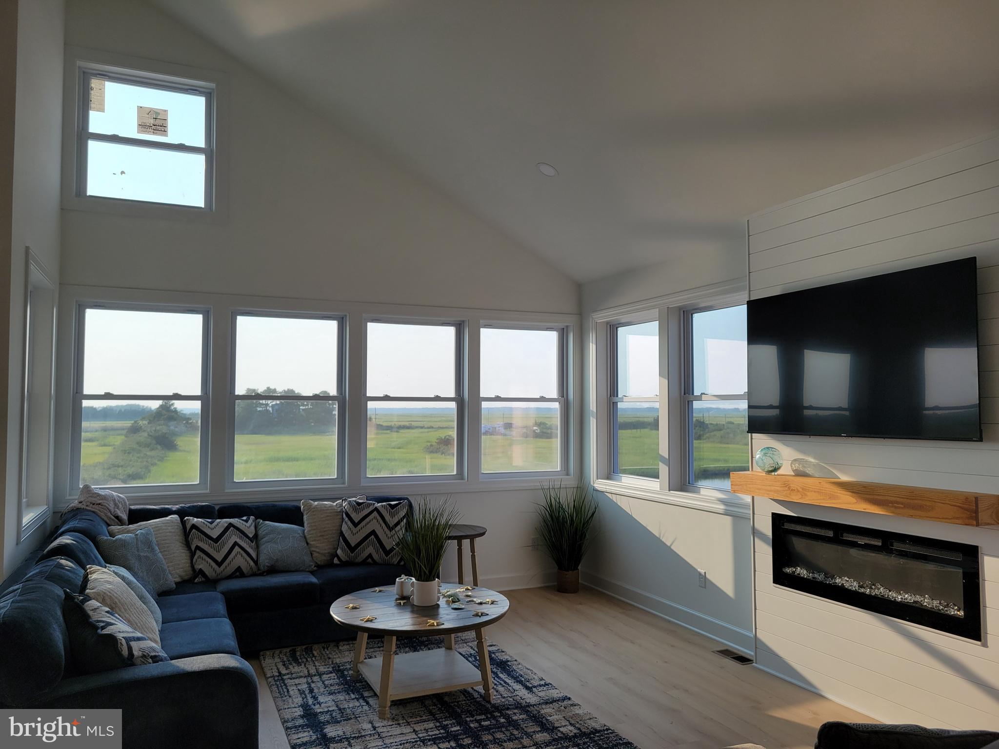 116 Sawyer Road Milford, DE 19963 - Photo 8 of 33 a living room with furniture and a flat screen tv