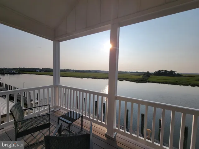 a view of a two chairs in the balcony