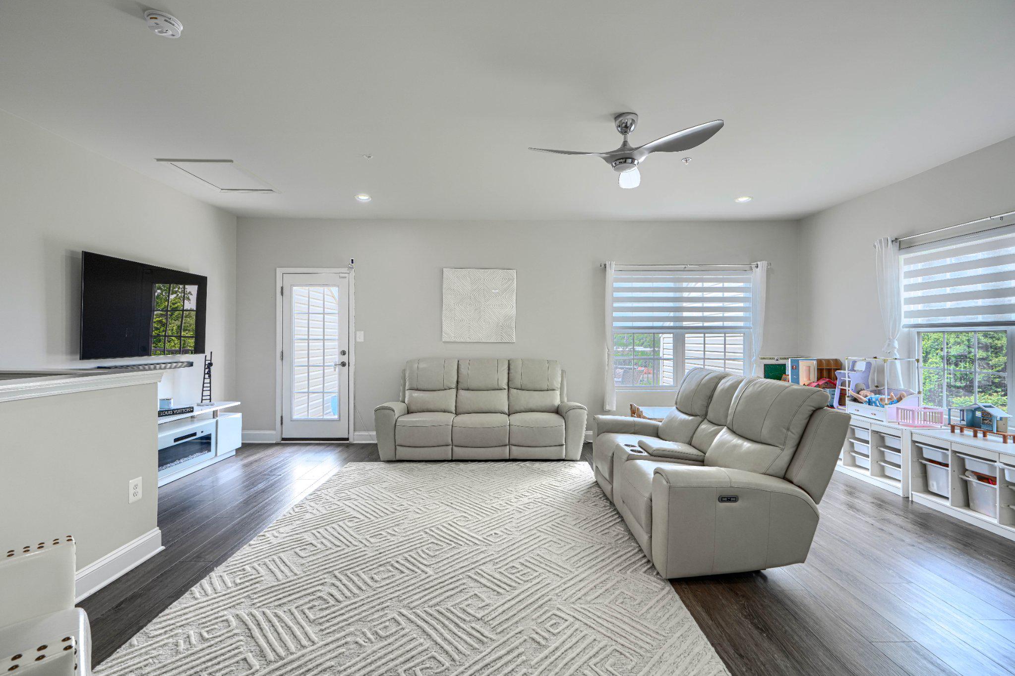2707 Lady Slipper Road Gambrills, MD 21054 - Photo 42 of 60 a living room with furniture and a flat screen tv