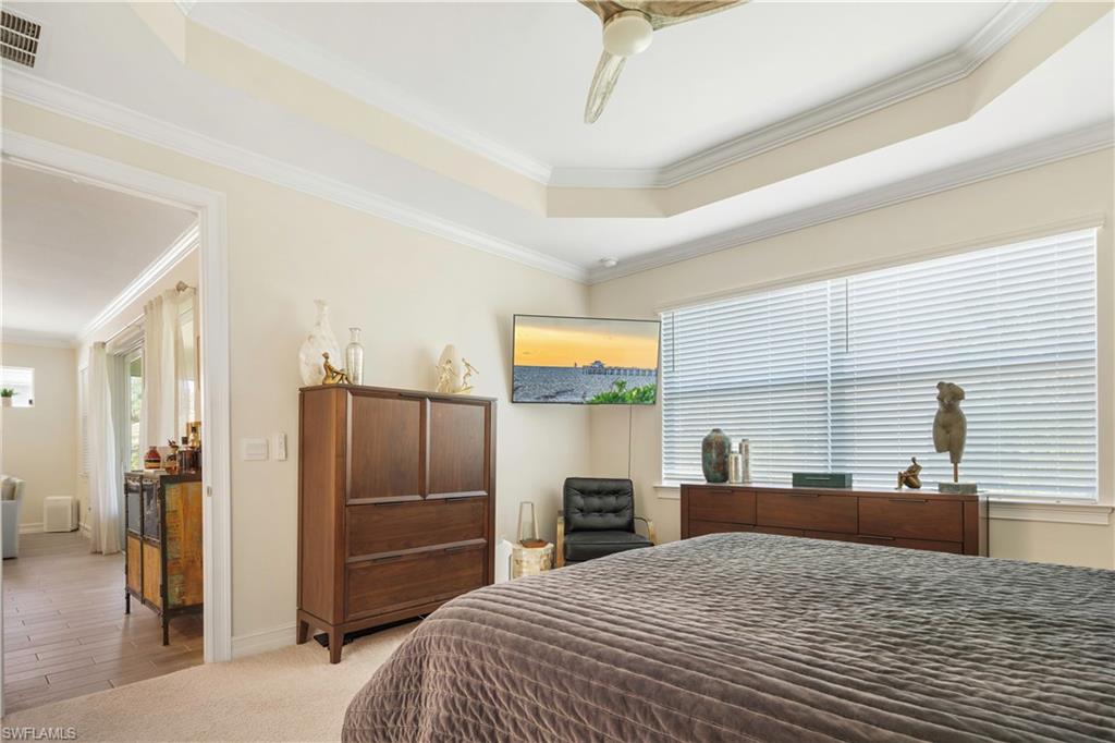 329 Deauville Loop Naples, FL 34114 - Photo 11 of 22 a bedroom with a bed and a television