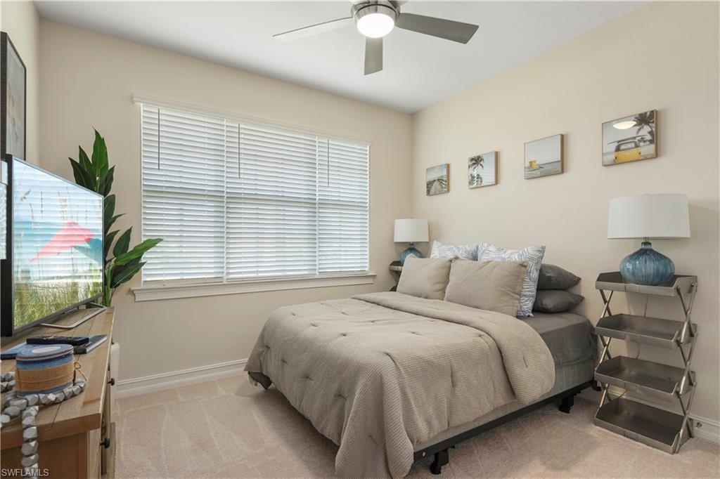 329 Deauville Loop Naples, FL 34114 - Photo 15 of 22 a bedroom with a bed and a flat screen tv