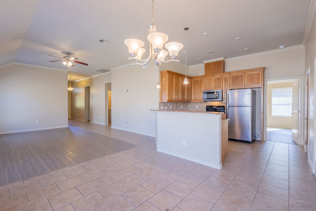 3309 Keefer Loop College Station, TX 77845 - Photo 6 of 27 a view of a kitchen with cabinets and stainless steel appliances