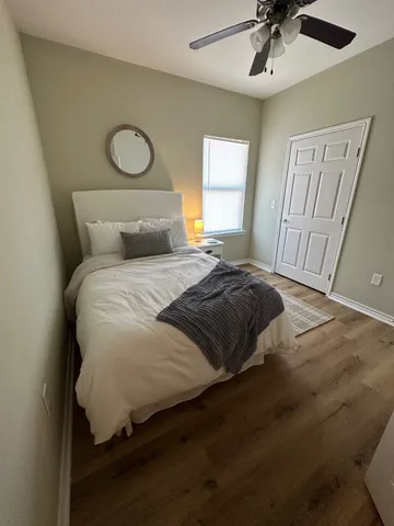 a bedroom with a bed and window