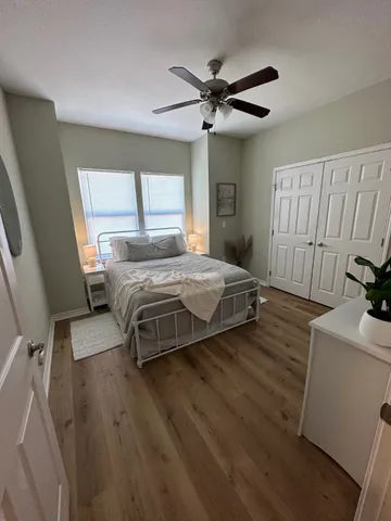 a bedroom with a bed and a dresser