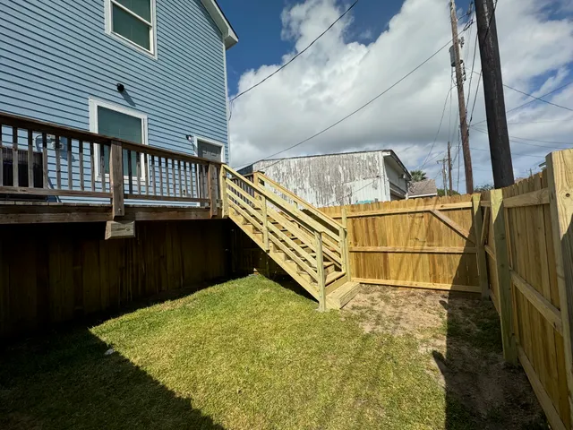 a view of a balcony with wooden floor