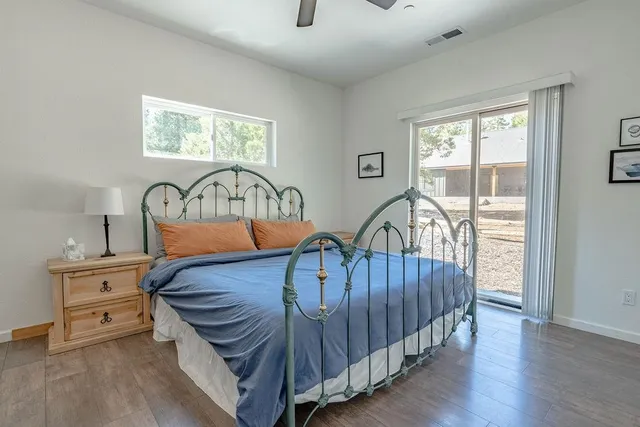 a bedroom with furniture and a window