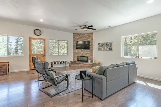 a living room with furniture and a large window