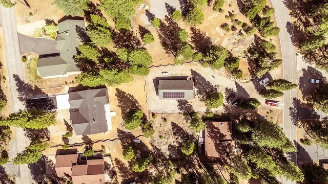 an aerial view of residential houses with outdoor space