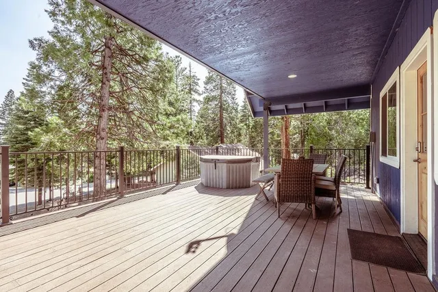 a view of a patio with table and chairs