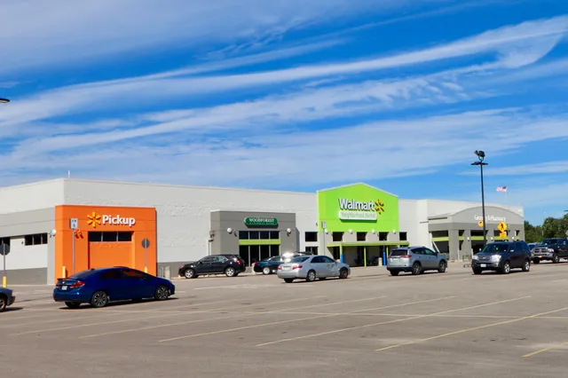 a large room with lots of cars parked on the road