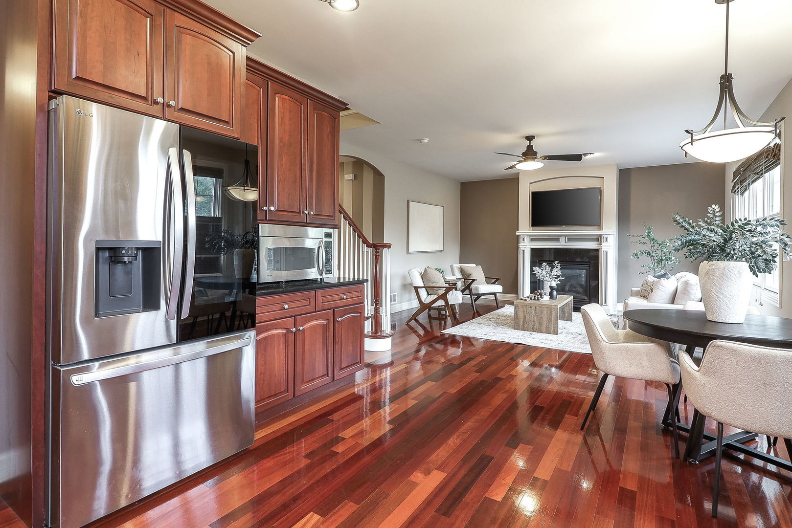 1208 Connamara Court Westmont, IL 60559 - Photo 11 of 36 a kitchen with stainless steel appliances granite countertop a refrigerator a stove top oven a sink dishwasher and dining table with wooden floor