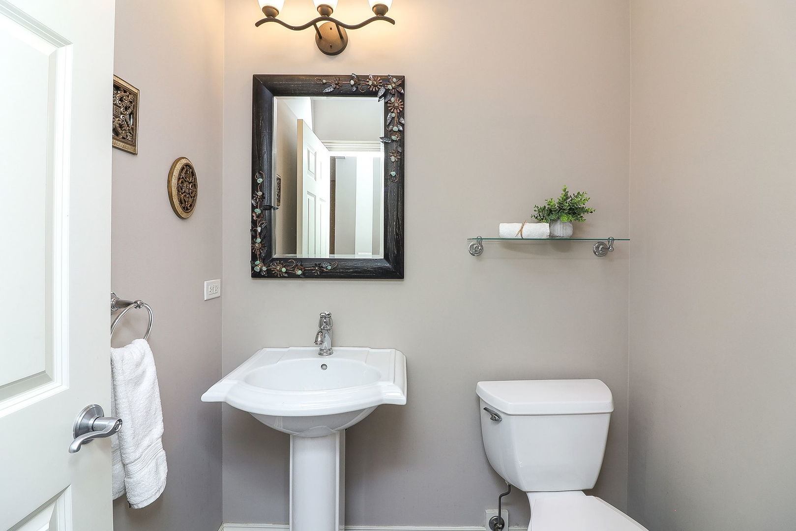 1208 Connamara Court Westmont, IL 60559 - Photo 15 of 36 a bathroom with a toilet sink and mirror