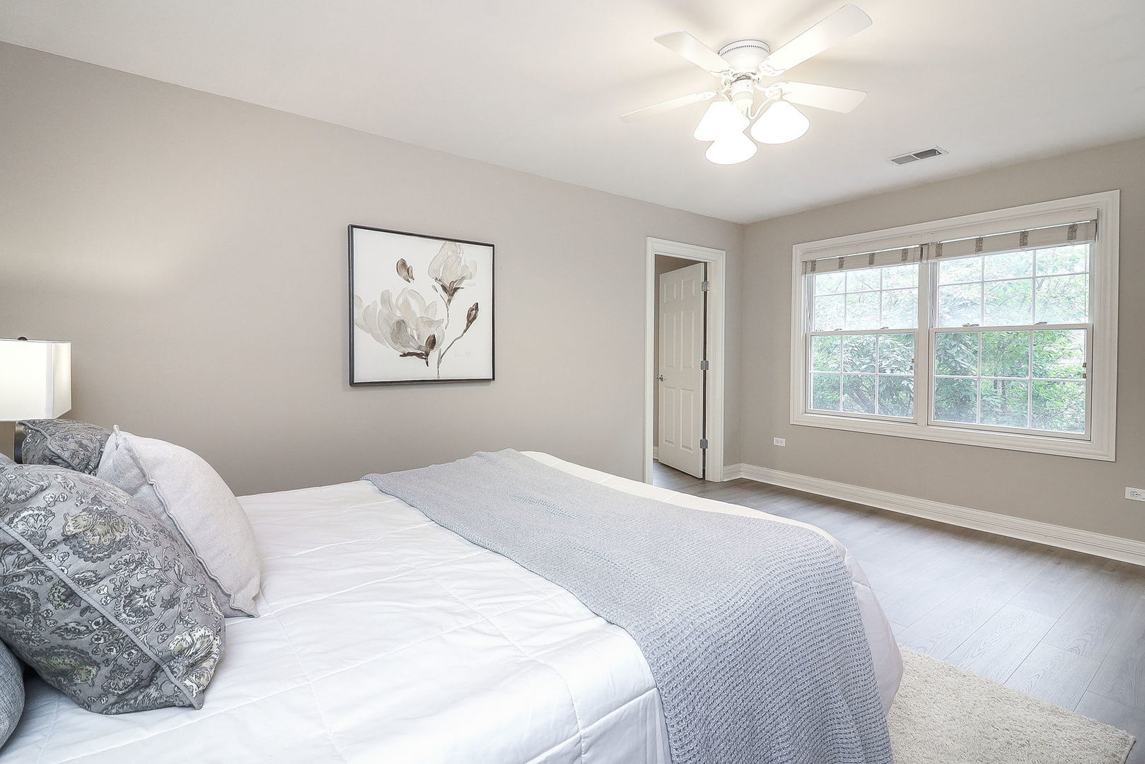 1208 Connamara Court Westmont, IL 60559 - Photo 21 of 36 a bedroom with a large bed and a window