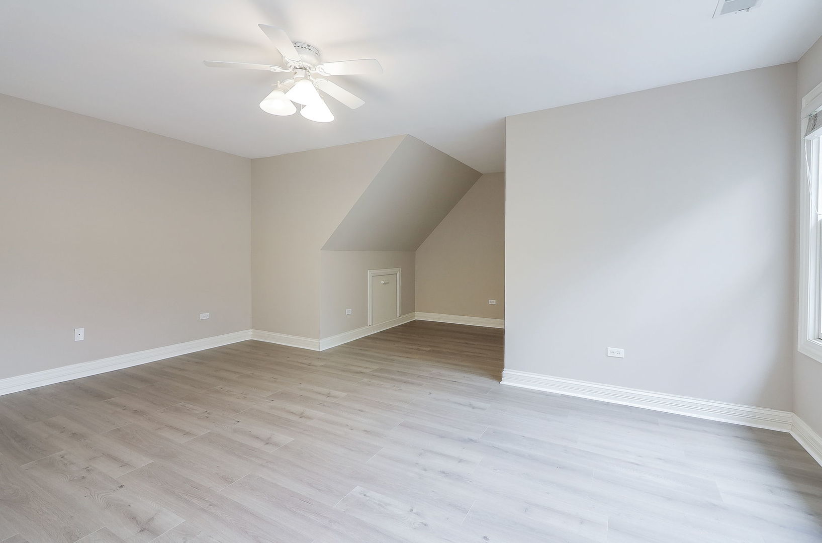 1208 Connamara Court Westmont, IL 60559 - Photo 22 of 36 wooden floor in an empty room with a window