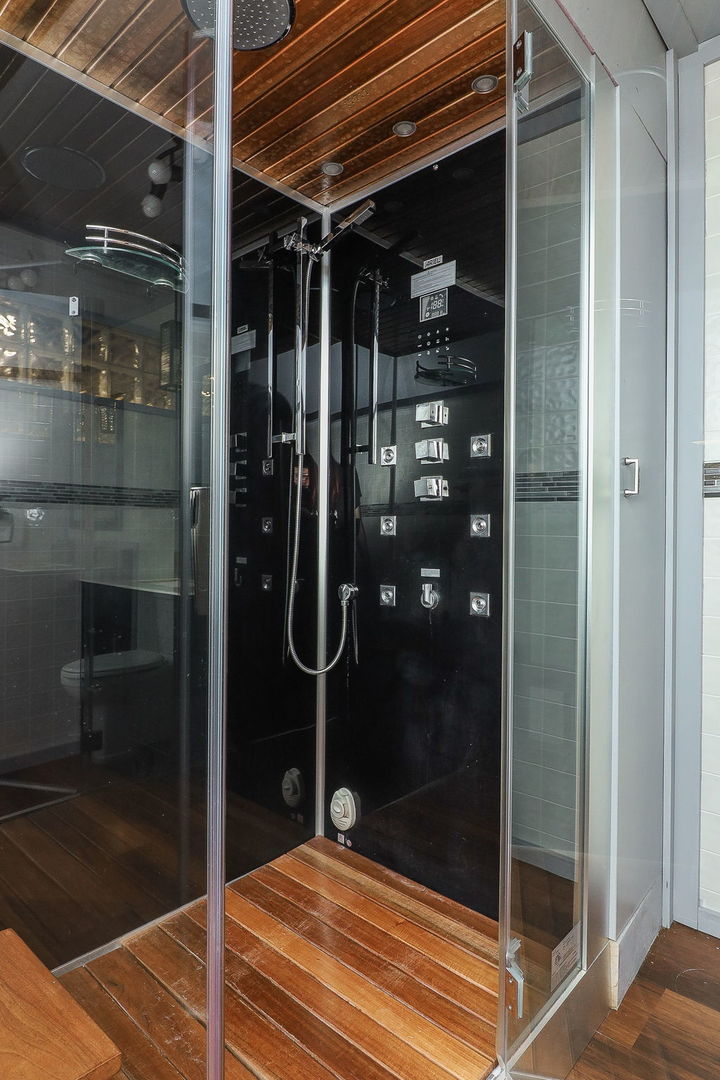 1208 Connamara Court Westmont, IL 60559 - Photo 34 of 36 a bathroom with a glass shower door