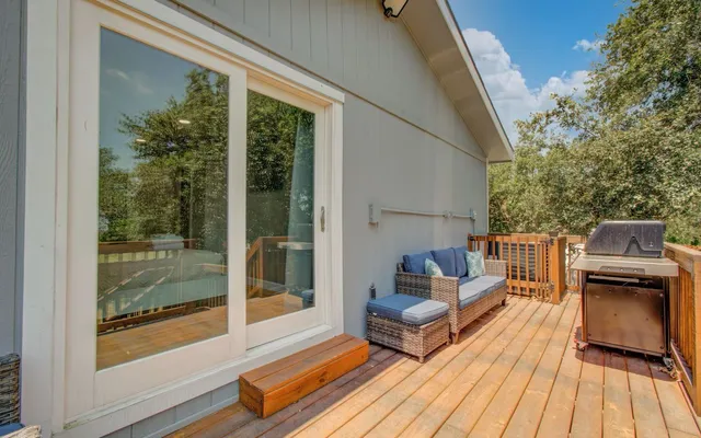 a balcony with furniture and wooden floor