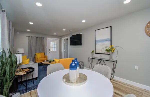 a living room with furniture and a flat screen tv