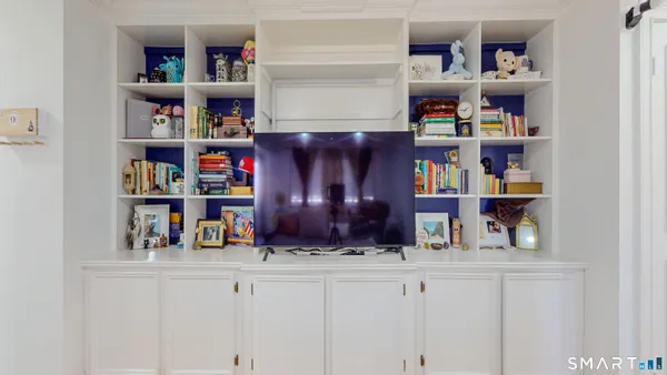 a bed room with a bed and a window