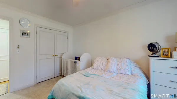 a bed room with a bed and a window