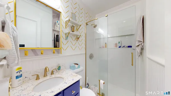 a bathroom with a sink and a mirror