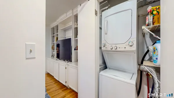 a balcony with furniture and a window
