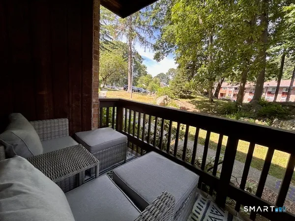 an outdoor space with pool and furniture