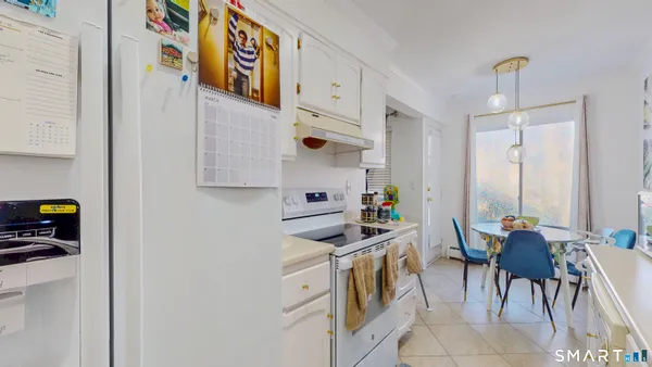 a kitchen with stainless steel appliances granite countertop a stove and a microwave
