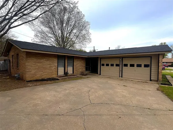a front view of a house with a garage