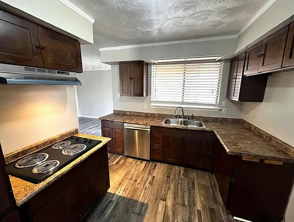 a kitchen with a stove and a microwave