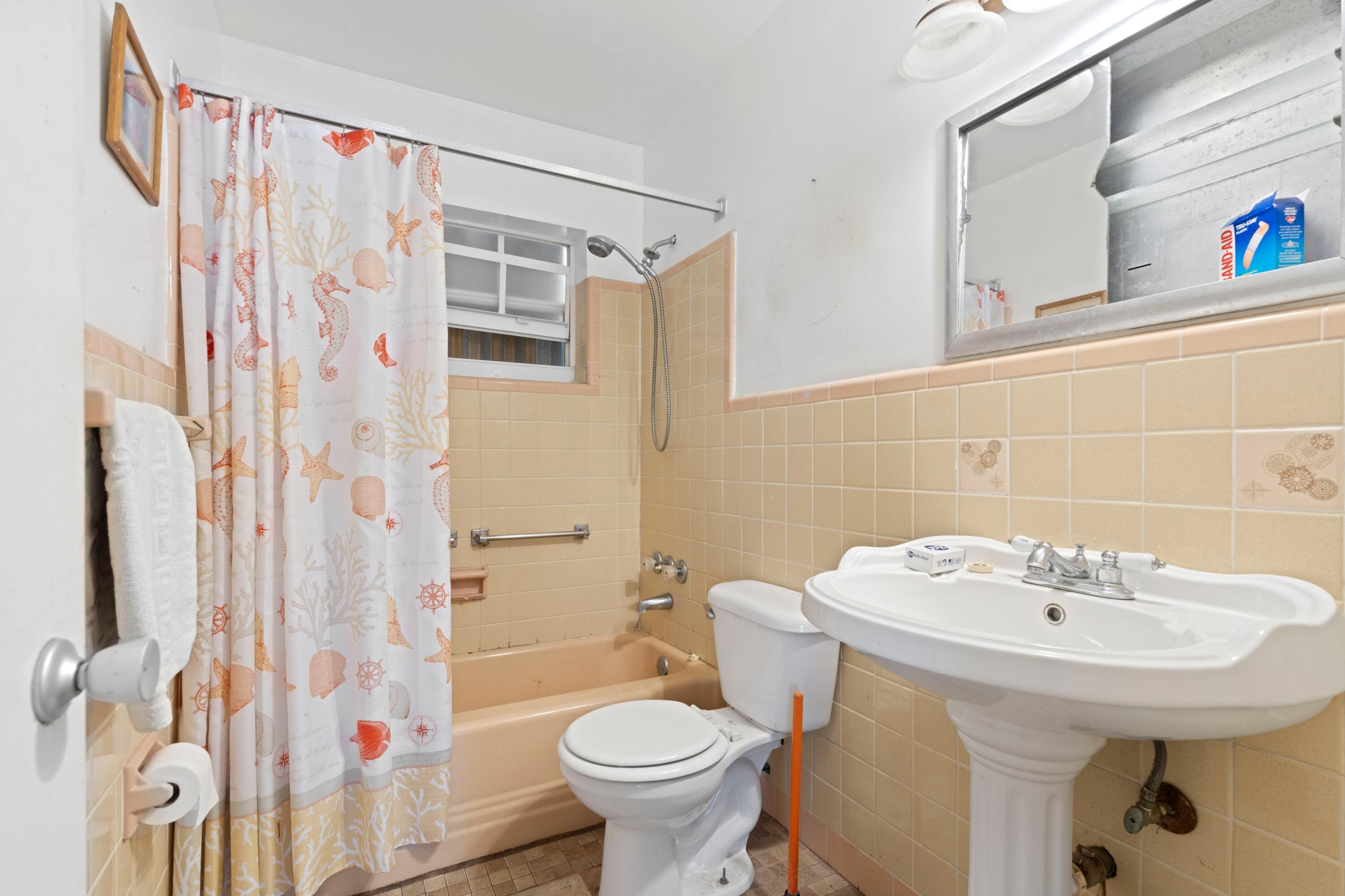 310 Southwest 2nd Street Boca Raton, FL 33432 - Photo 11 of 17 a bathroom with a sink toilet and shower