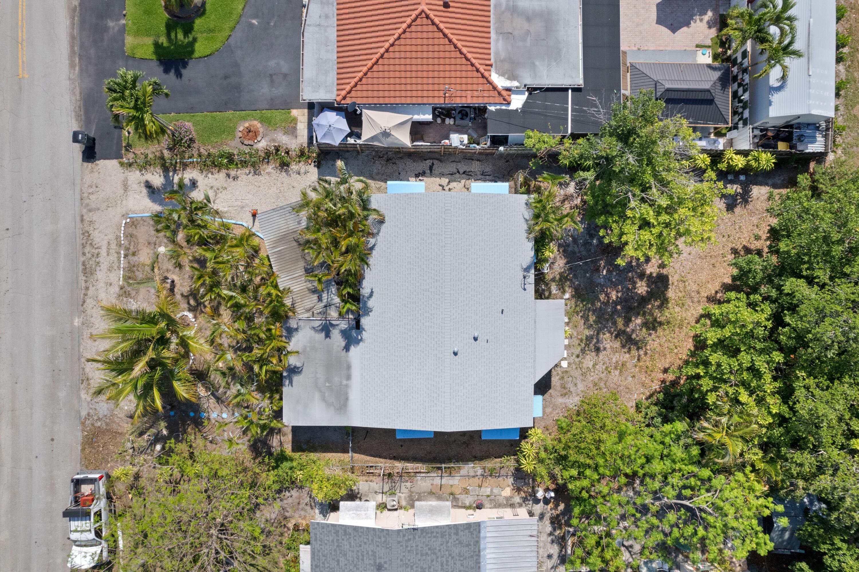 310 Southwest 2nd Street Boca Raton, FL 33432 - Photo 4 of 17 an aerial view of a house with a yard and garden in the back