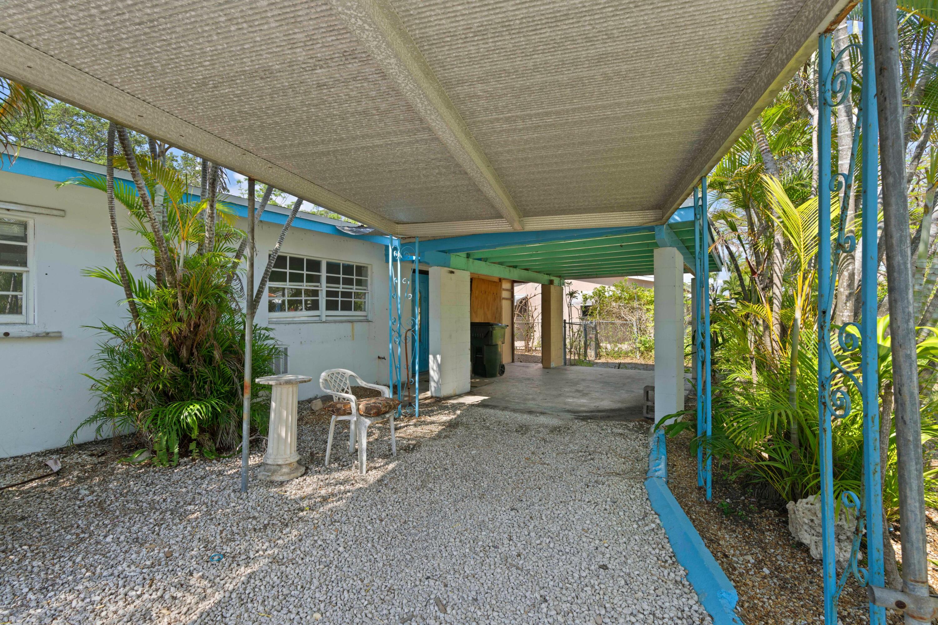 310 Southwest 2nd Street Boca Raton, FL 33432 - Photo 5 of 17 a view of a porch with chairs and floor