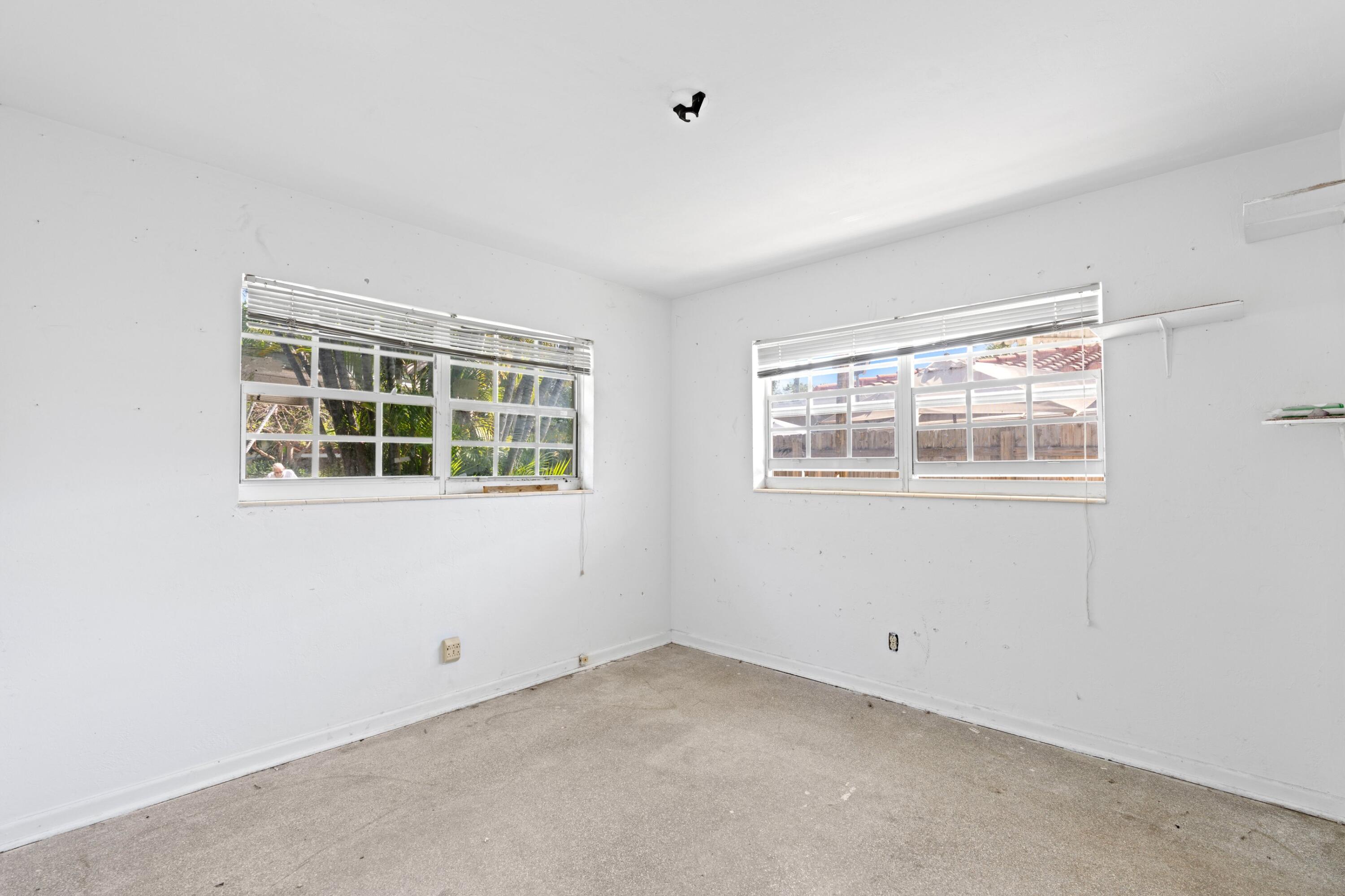 310 Southwest 2nd Street Boca Raton, FL 33432 - Photo 8 of 17 a view of an empty room with a window