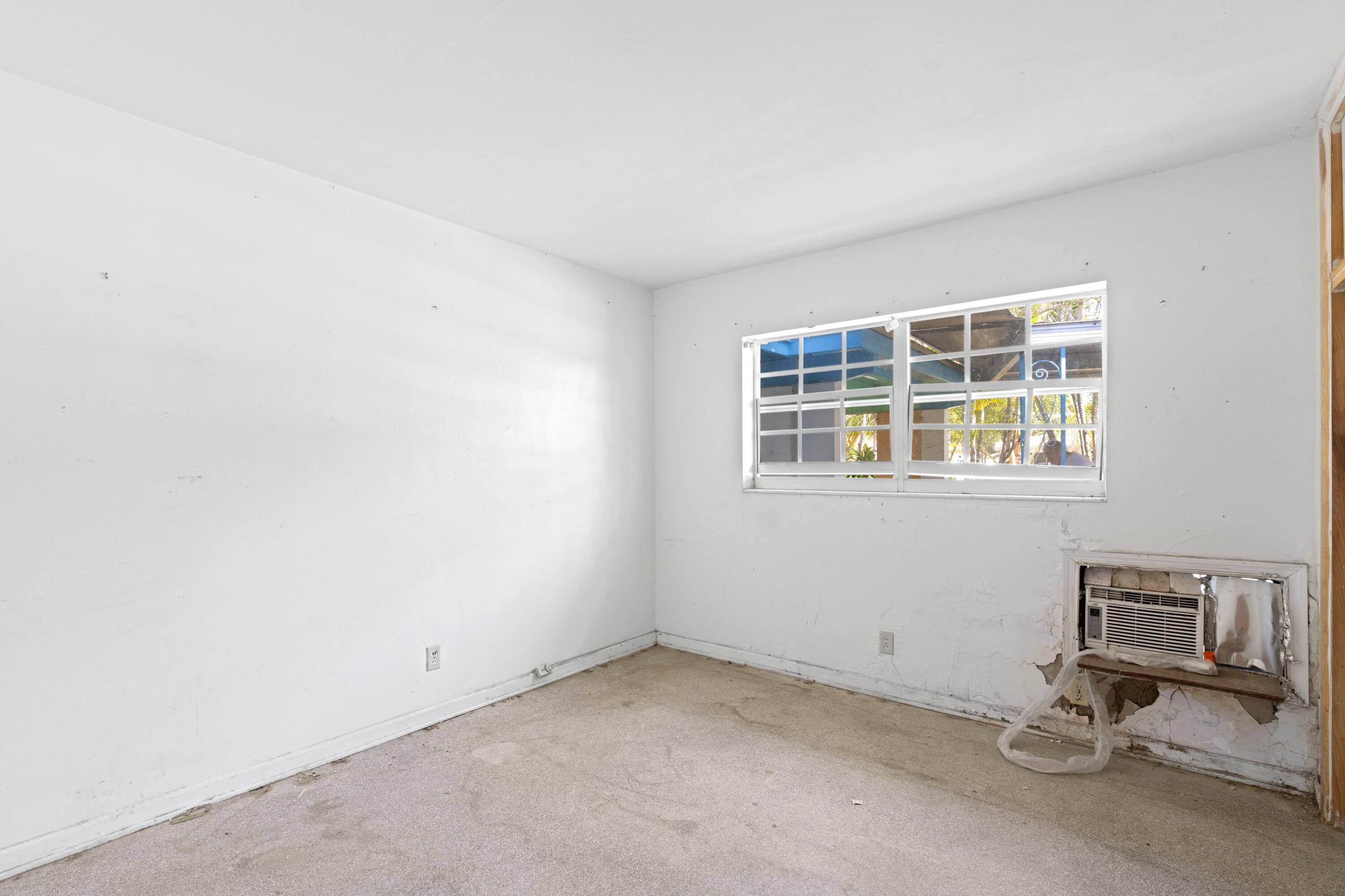 310 Southwest 2nd Street Boca Raton, FL 33432 - Photo 10 of 17 an empty room with windows