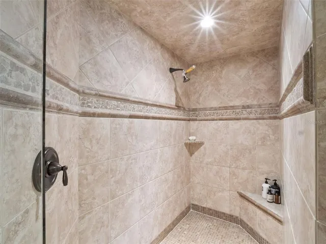 a view of a porch with furniture and garden