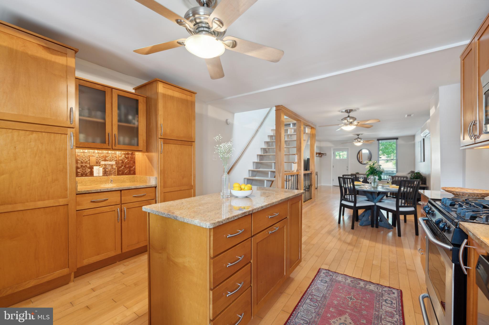 3461 Keswick Road Baltimore, MD 21211 - Photo 17 of 25 a kitchen with sink cabinets and wooden floor