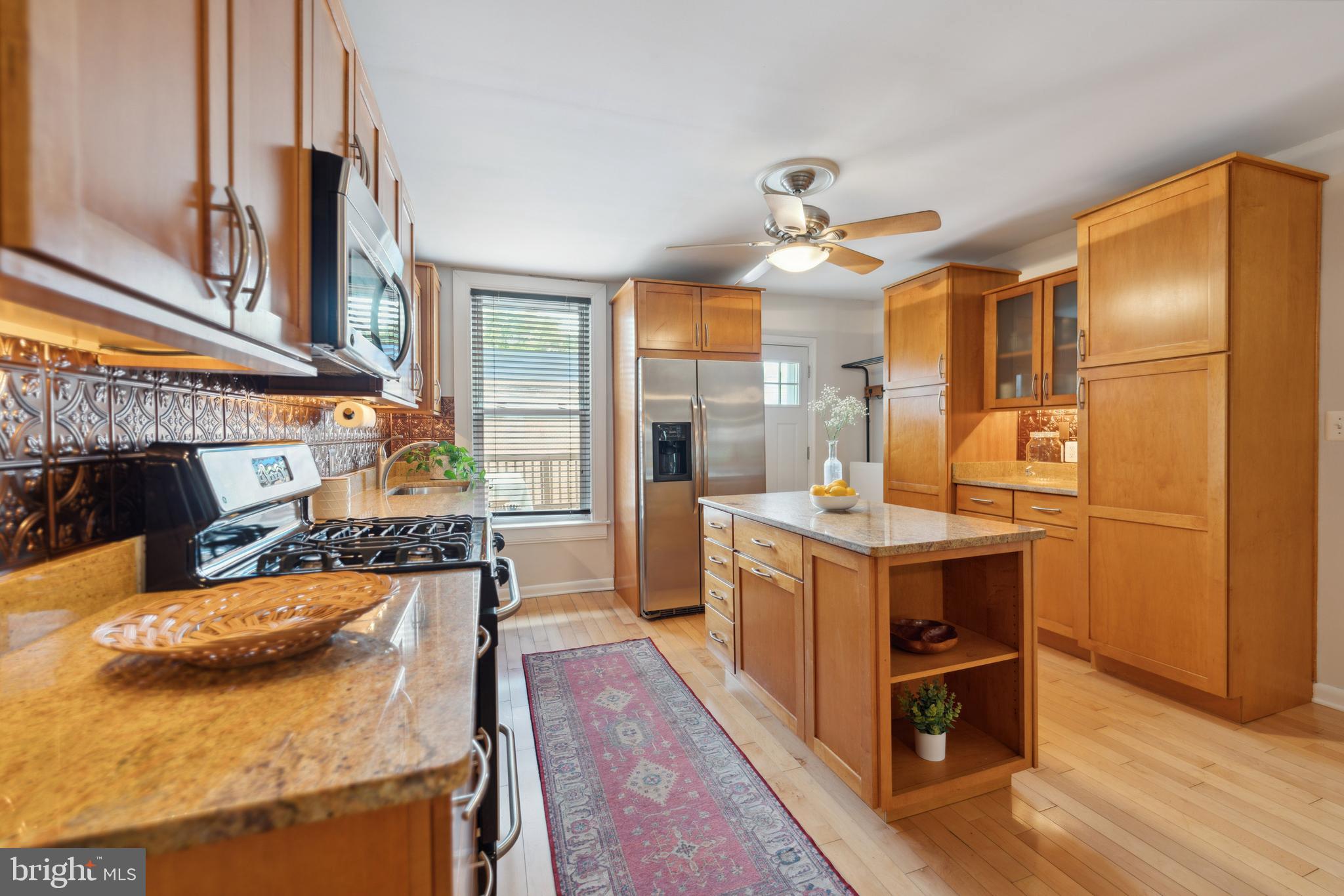 3461 Keswick Road Baltimore, MD 21211 - Photo 18 of 25 a kitchen with sink stove and refrigerator