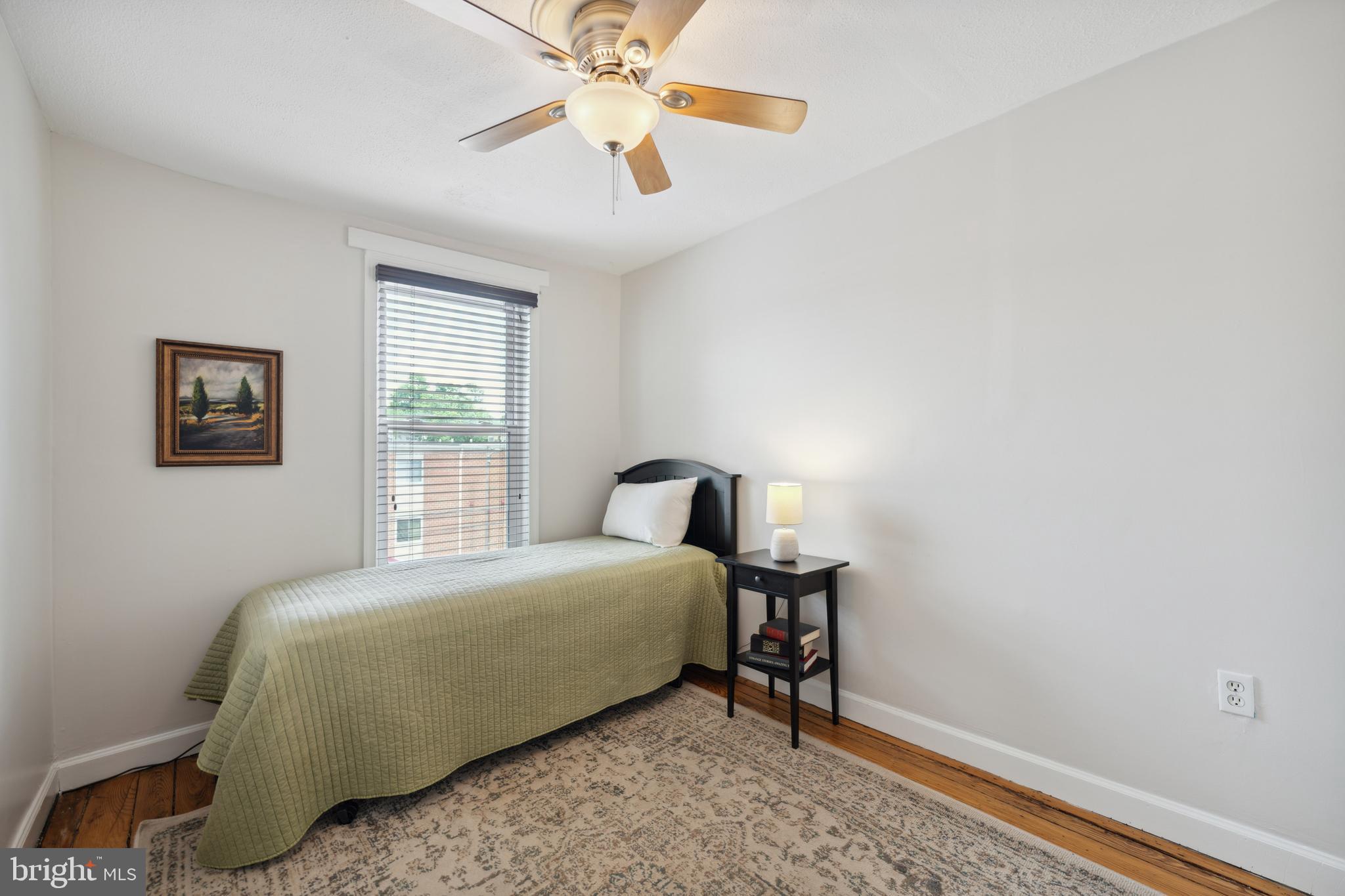 3461 Keswick Road Baltimore, MD 21211 - Photo 22 of 25 a bedroom with a bed and a window