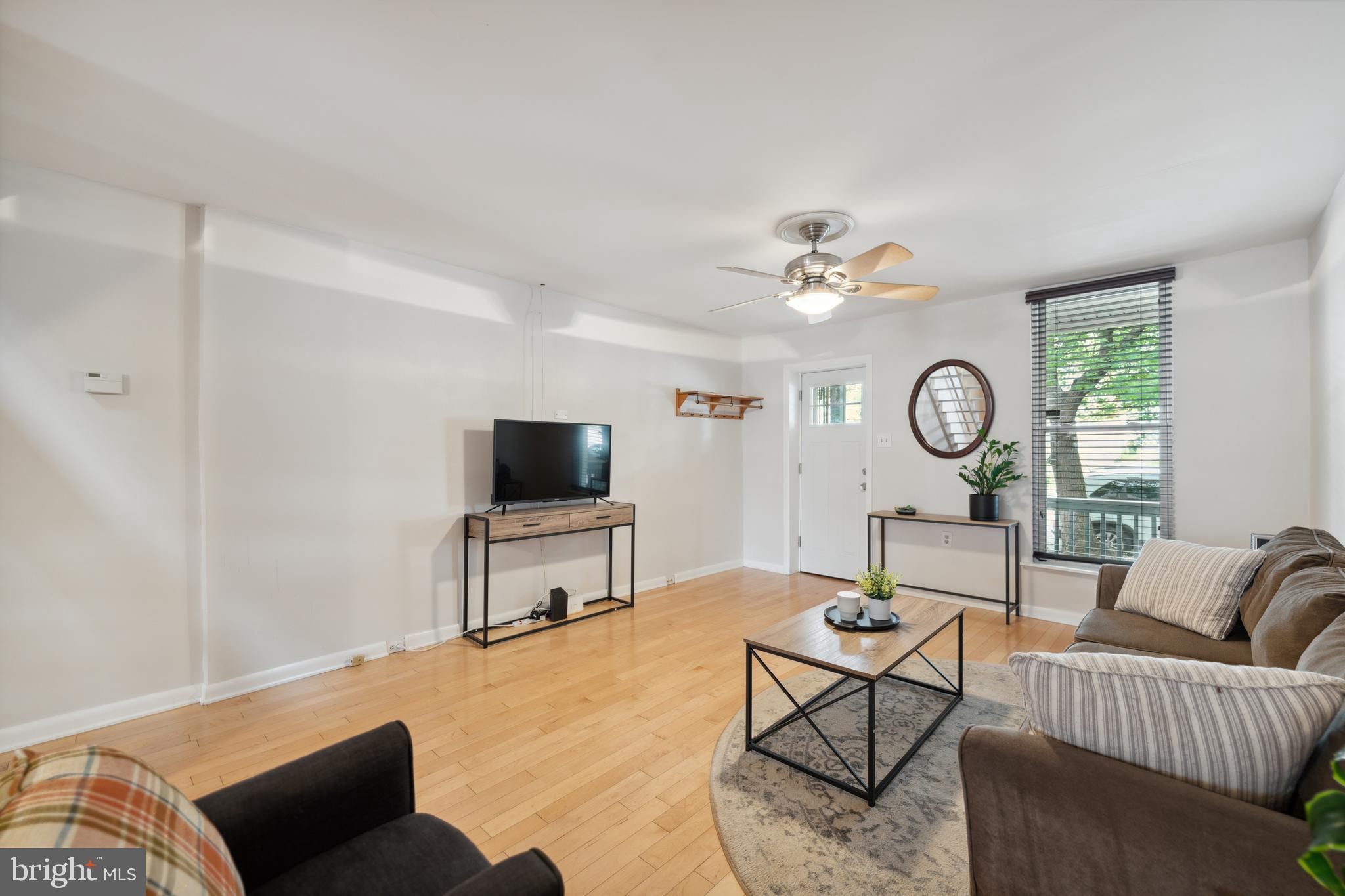 3461 Keswick Road Baltimore, MD 21211 - Photo 4 of 25 a living room with furniture and a flat screen tv