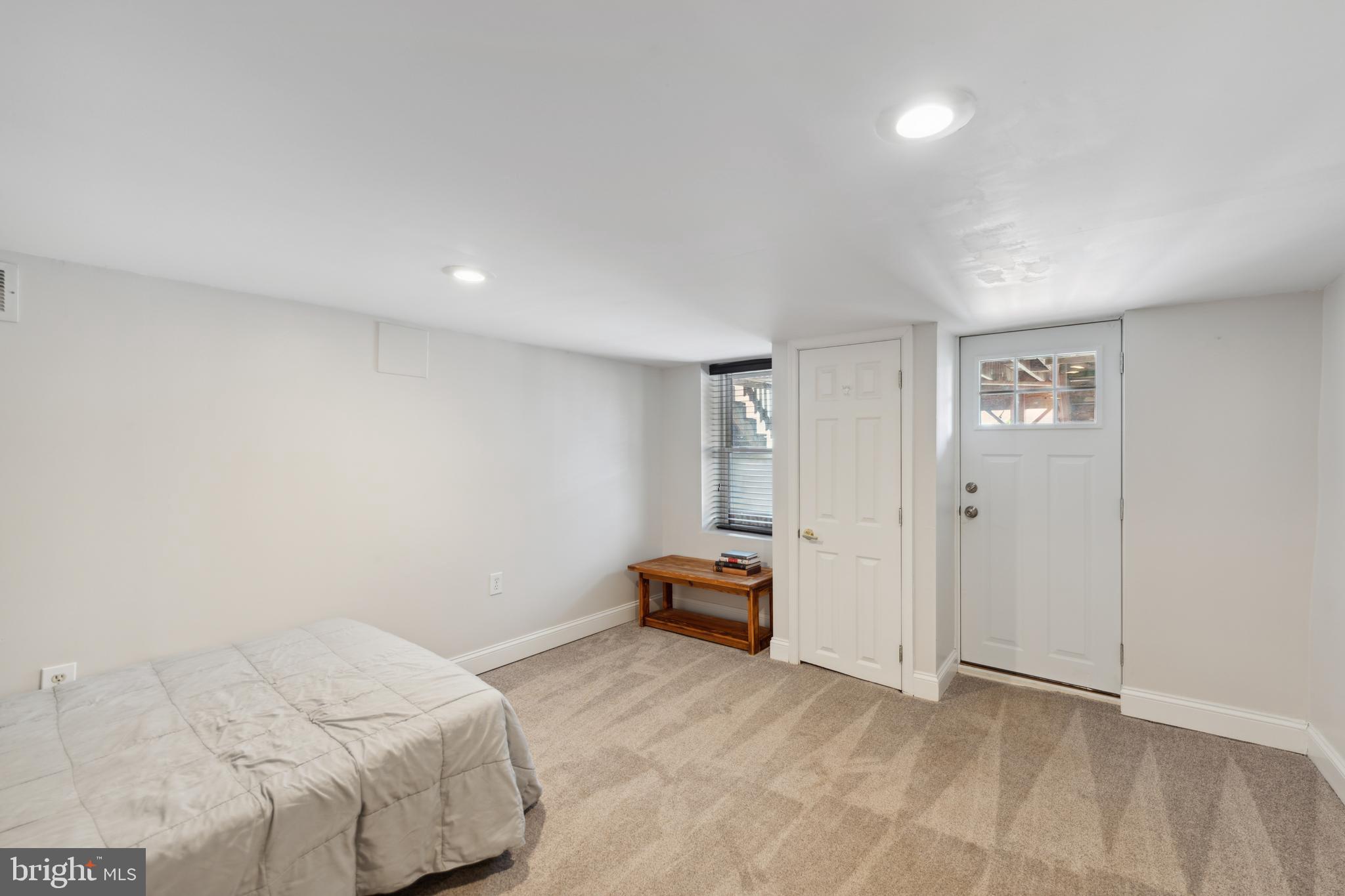 3461 Keswick Road Baltimore, MD 21211 - Photo 6 of 25 a bedroom with a bed and hallway