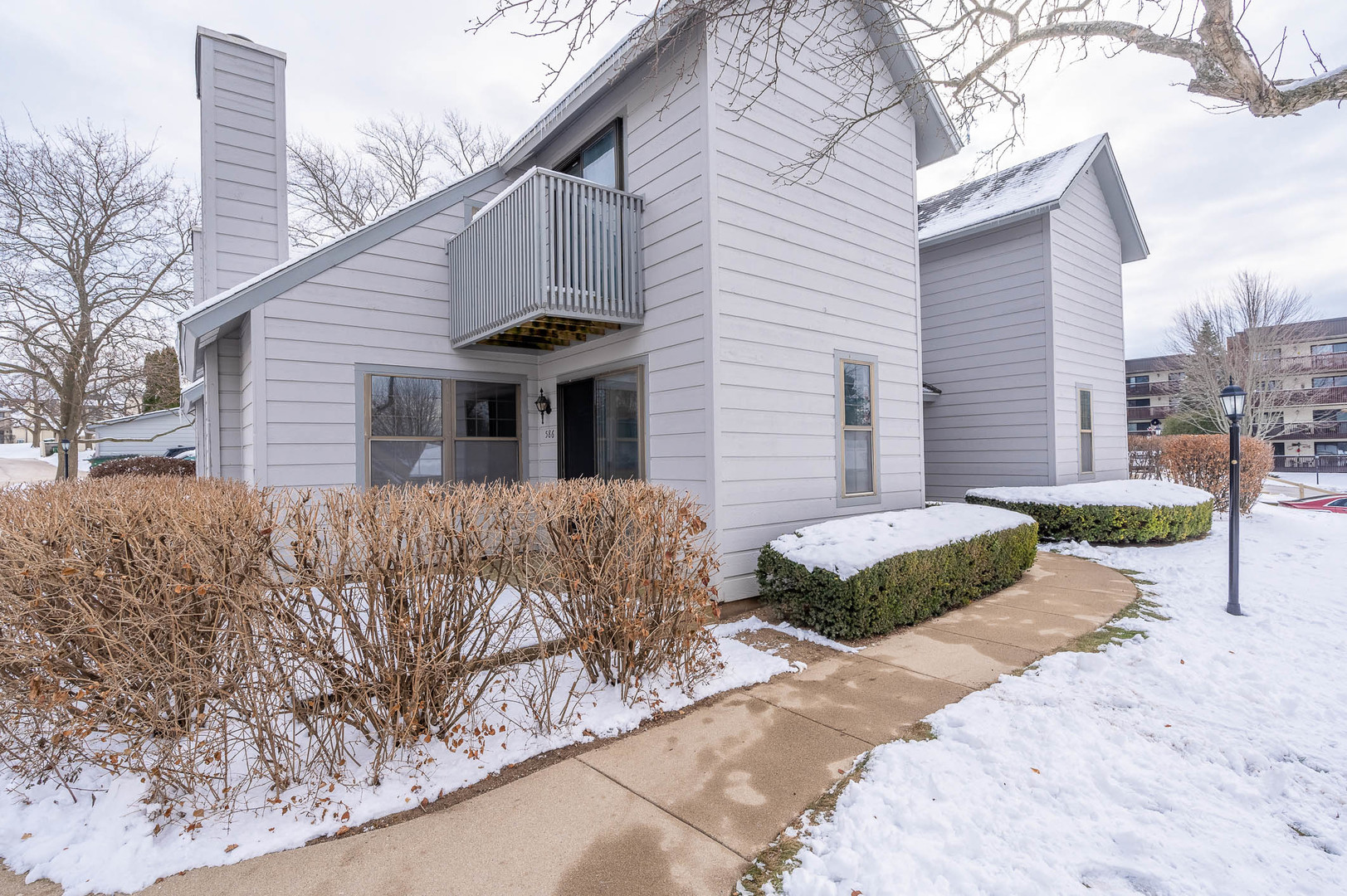 586 Dunham Road Gurnee, IL 60031 - Photo 1 of 13 a front view of a house with a yard